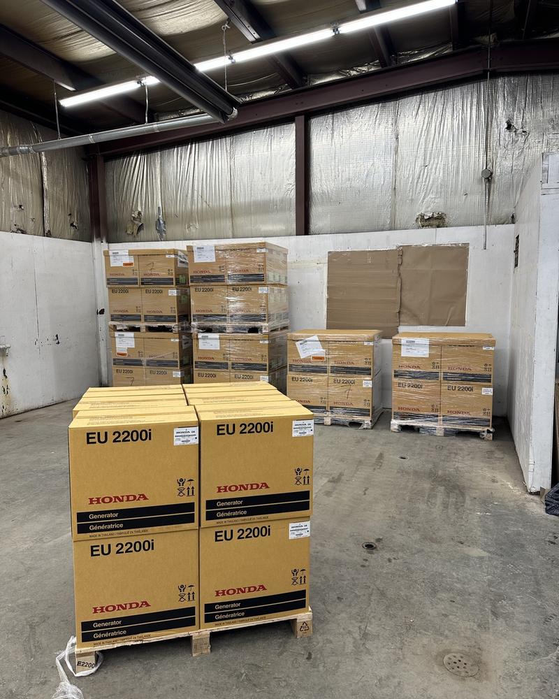 Pallets of Honda generators waiting to be freighted north