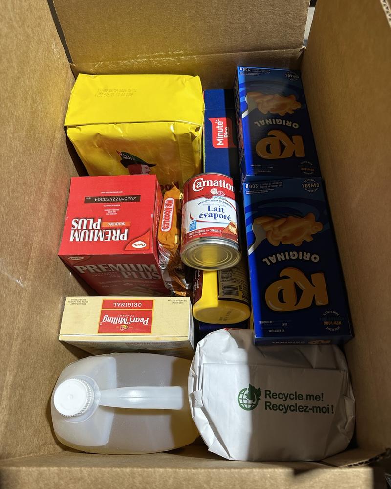 A food hamper packed and boxed to a program list