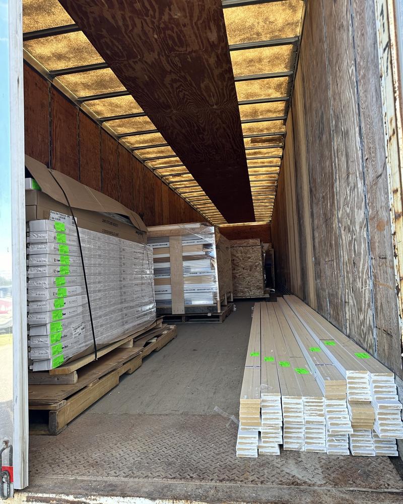 Trim and building materials loaded down the length of a trailer